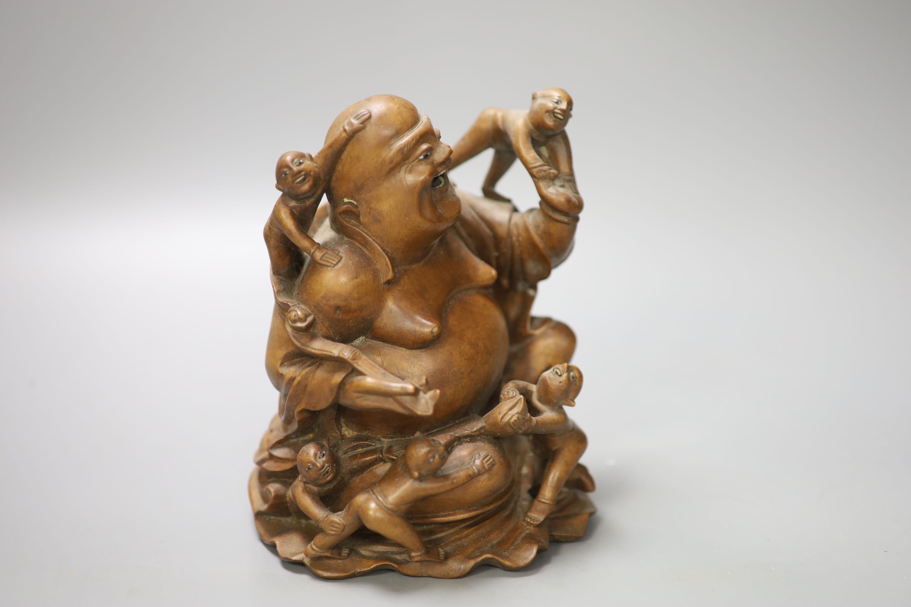 A Chinese carved hardwood figure of Budai, height 17cm
